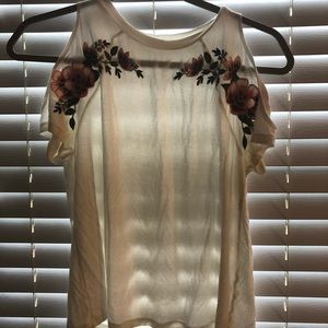 A white off the shoulder tee shirt.